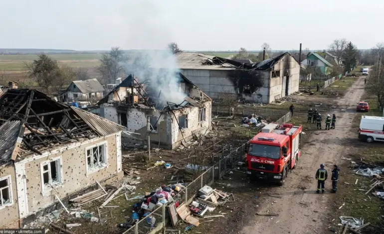 Emergency responders inspect damage after a Russian attack in Sumy region.